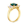 Emerald-Cut Lab-Created Emerald and White Topaz Three Stone Ring in 10K Gold