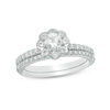 Thumbnail Image 0 of 4.5mm Lab-Created White Sapphire and 0.15 CT. T.W. Diamond Flower Bridal Set in Sterling Silver