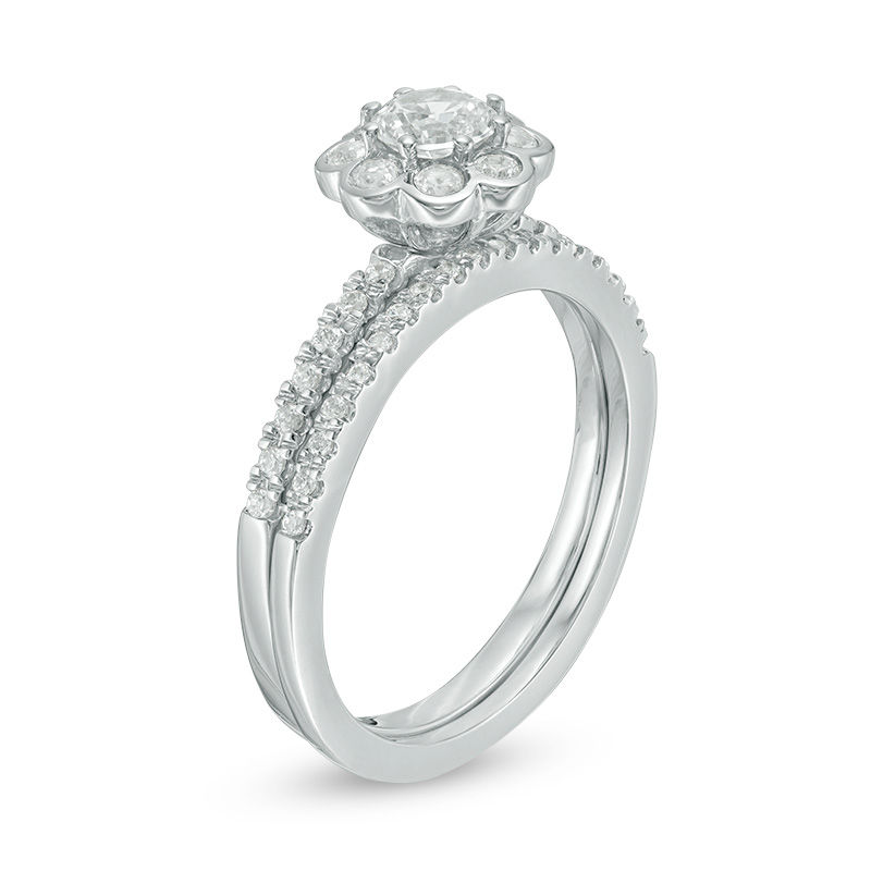 4.5mm Lab-Created White Sapphire and 0.15 CT. T.W. Diamond Flower Bridal Set in Sterling Silver