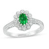 Thumbnail Image 0 of Oval Lab-Created Emerald and 0.15 CT. T.W. Diamond Flower Frame Engagement Ring in Sterling Silver