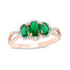 Thumbnail Image 0 of Oval Lab-Created Emerald and 0.15 CT. T.W. Diamond Frame Three Stone Engagement Ring in 10K Rose Gold