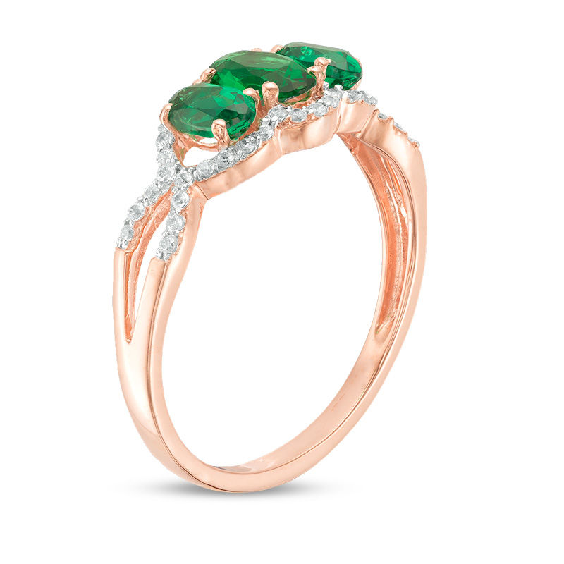 Oval Lab-Created Emerald and 0.15 CT. T.W. Diamond Frame Three Stone Engagement Ring in 10K Rose Gold