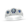 Thumbnail Image 0 of Lab-Created Blue and White Sapphire Frame Three Stone Bridal Set in 10K White Gold