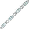 Thumbnail Image 0 of Oval Aquamarine and 0.46 CT. T.W. Diamond "O" Bracelet in Sterling Silver - 7.5"