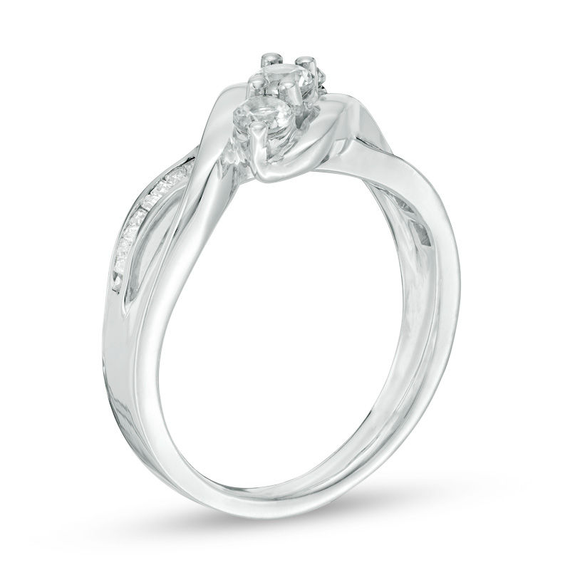 Lab-Created White Sapphire and 0.11 CT. T.W. Baguette Diamond Three Stone Slant Ring in Sterling Silver