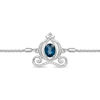 Thumbnail Image 1 of Enchanted Disney Cinderella Oval Blue Topaz and 0.085 CT. T.W. Diamond Carriage Bolo Bracelet in Sterling Silver - 9.5"