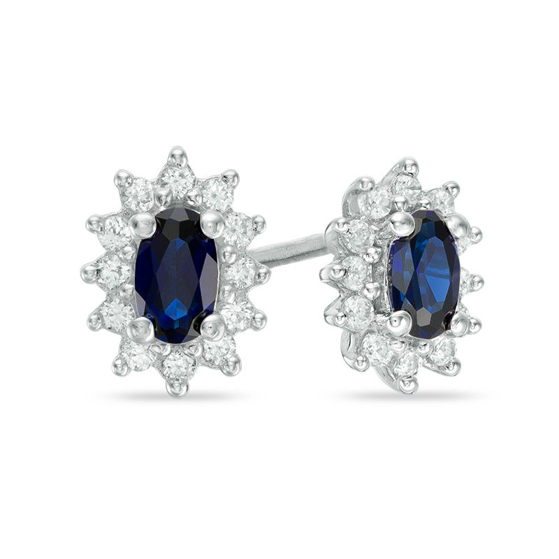 Oval Blue Sapphire and 0.21 CT. T.W. Diamond Starburst Frame Stud Earrings in 10K White Gold|Peoples Jewellers