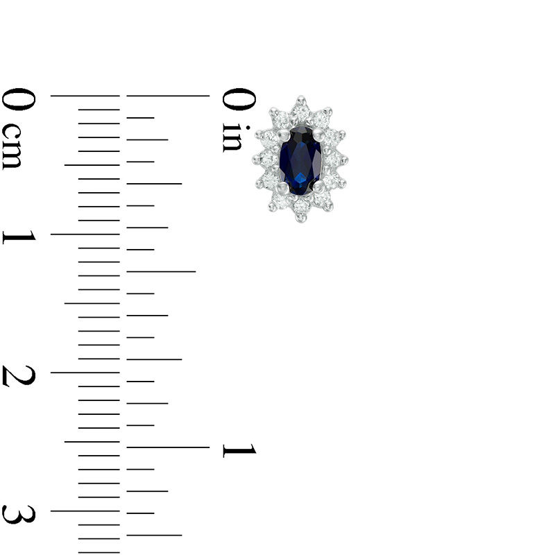 Main Image 2 of Oval Blue Sapphire and 0.21 CT. T.W. Diamond Starburst Frame Stud Earrings in 10K White Gold