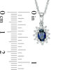 Thumbnail Image 1 of Oval Blue Sapphire and 0.18 CT. T.W. Diamond Starburst Frame Pendant in 10K White Gold