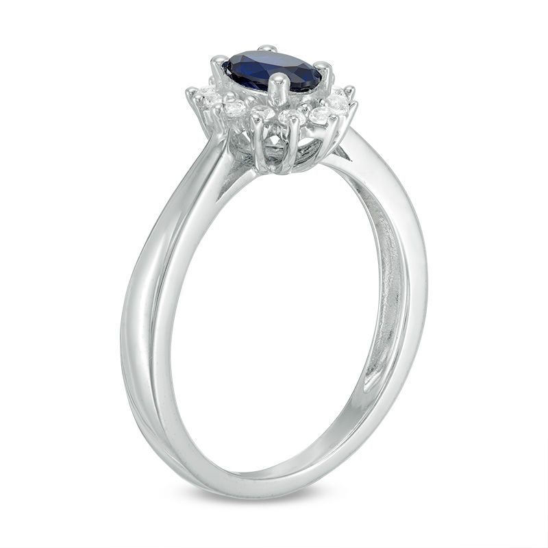 Oval Blue Sapphire and 0.18 CT. T.W. Diamond Starburst Frame Ring in 10K White Gold