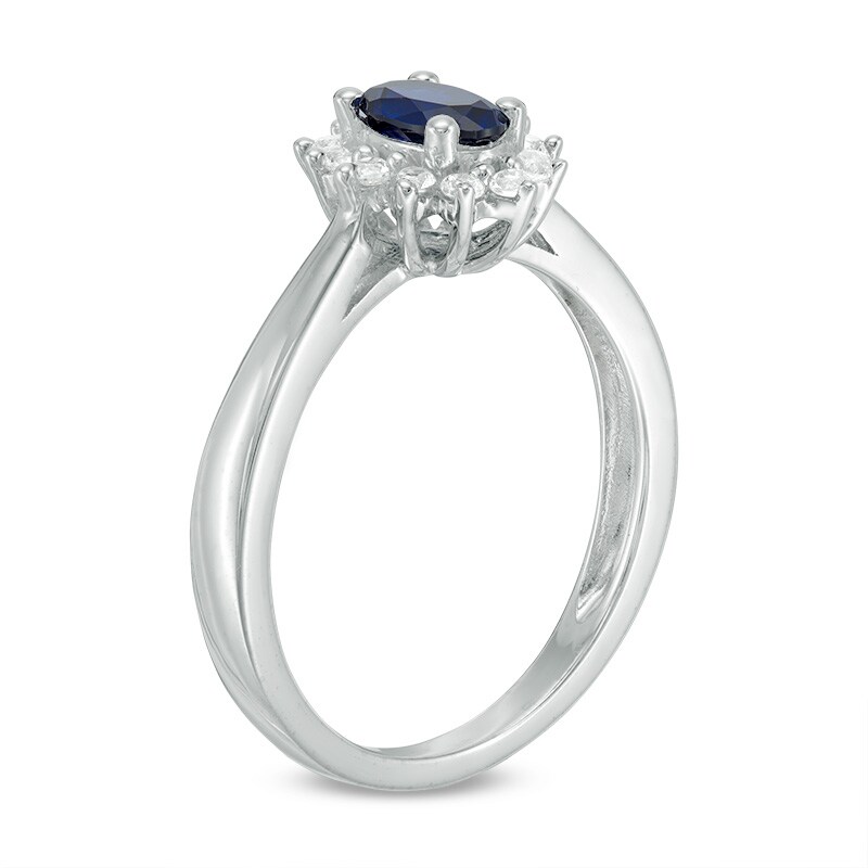 Oval Blue Sapphire and 0.18 CT. T.W. Diamond Starburst Frame Ring 10K White Gold