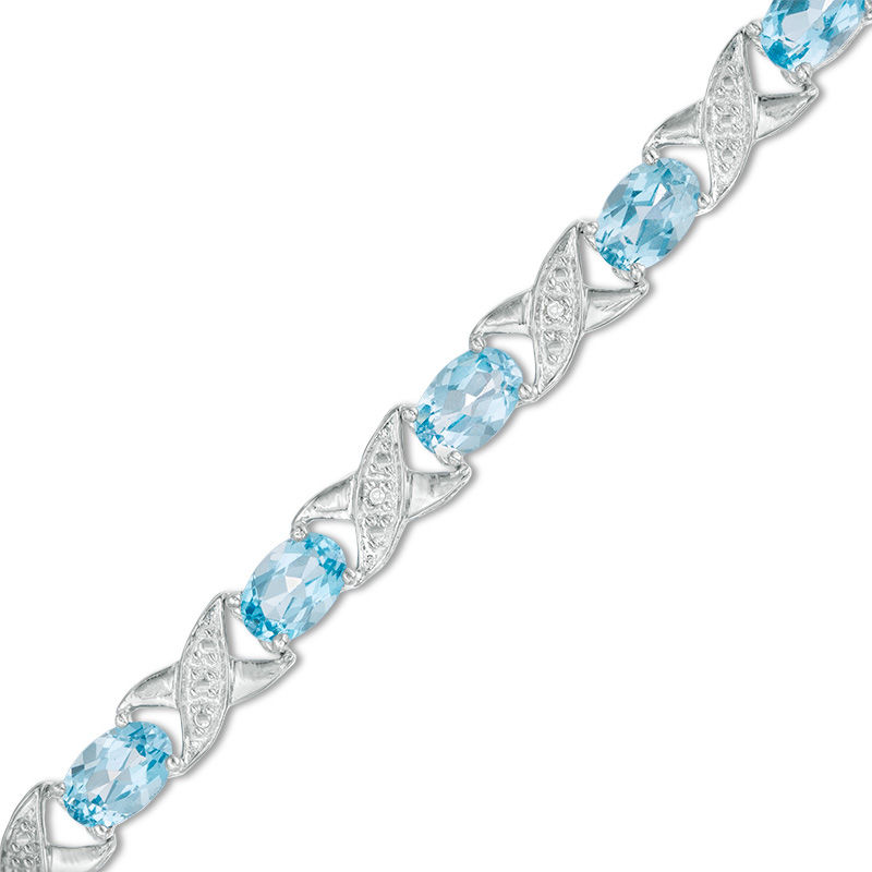 Main Image 1 of Sideways Oval Swiss Blue Topaz and Diamond Accent "XO" Bracelet in Sterling Silver - 7.25"