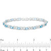 Thumbnail Image 1 of Sideways Oval Swiss Blue Topaz and Diamond Accent "XO" Bracelet in Sterling Silver - 7.25"
