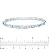 Thumbnail Image 2 of Sideways Oval Swiss Blue Topaz and Diamond Accent "XO" Bracelet in Sterling Silver - 7.25"