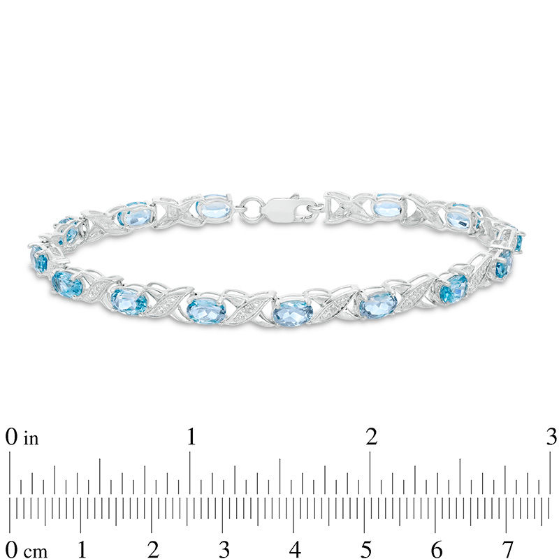 Main Image 2 of Sideways Oval Swiss Blue Topaz and Diamond Accent "XO" Bracelet in Sterling Silver - 7.25"