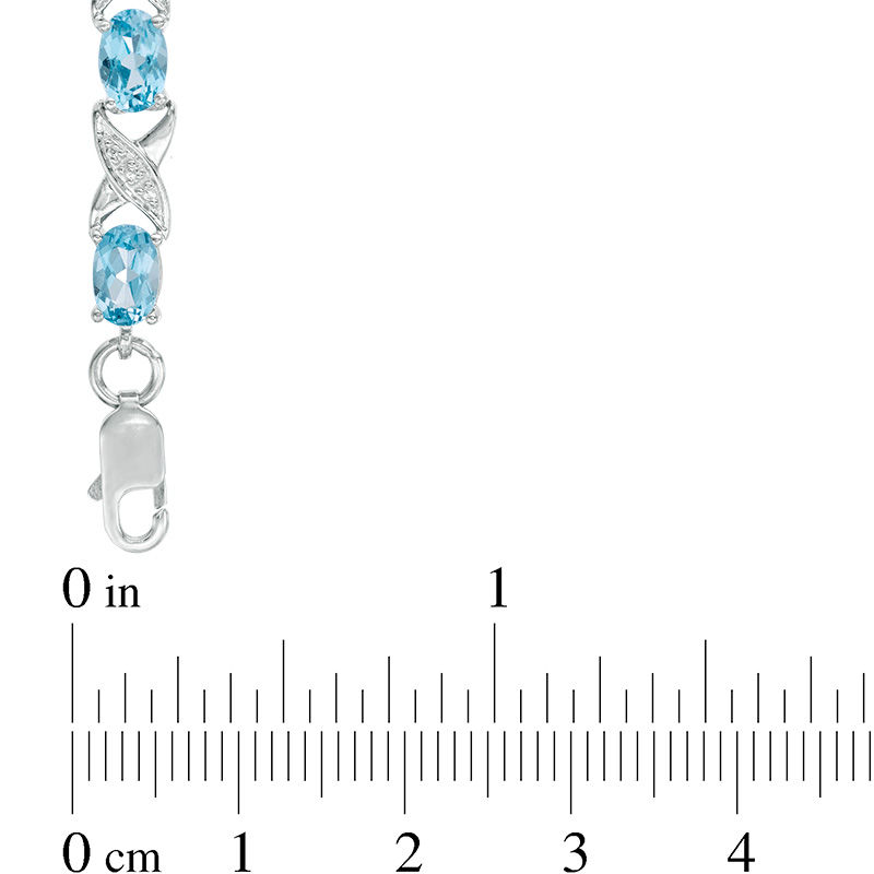 Sideways Oval Swiss Blue Topaz and Diamond Accent "XO" Bracelet in Sterling Silver - 7.25"