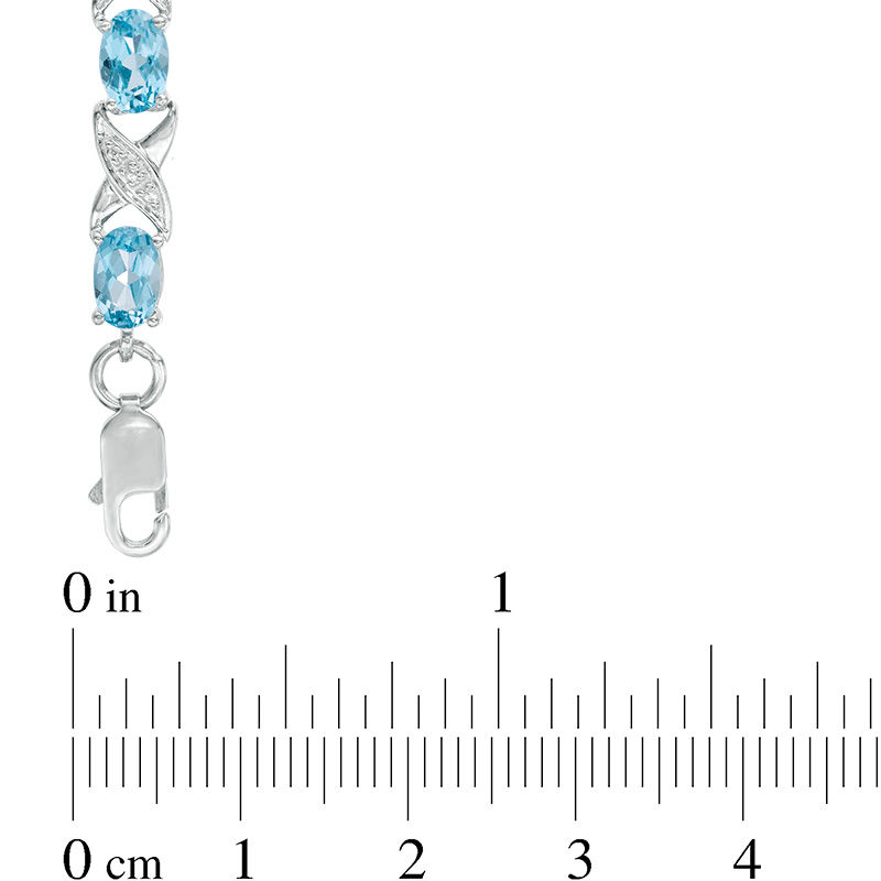Main Image 3 of Sideways Oval Swiss Blue Topaz and Diamond Accent "XO" Bracelet in Sterling Silver - 7.25"