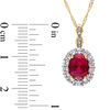 Oval Lab-Created Ruby, White Topaz and Diamond Accent Frame Pendant in 14K Gold – 17"