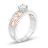 Thumbnail Image 1 of 0.18 CT. T.W. Diamond Twist Shank Promise Ring in Sterling Silver and 10K Rose Gold