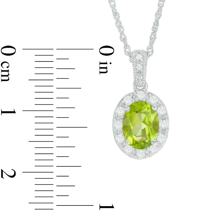 Oval Peridot and Lab-Created White Sapphire Frame Vintage-Style Pendant in Sterling Silver