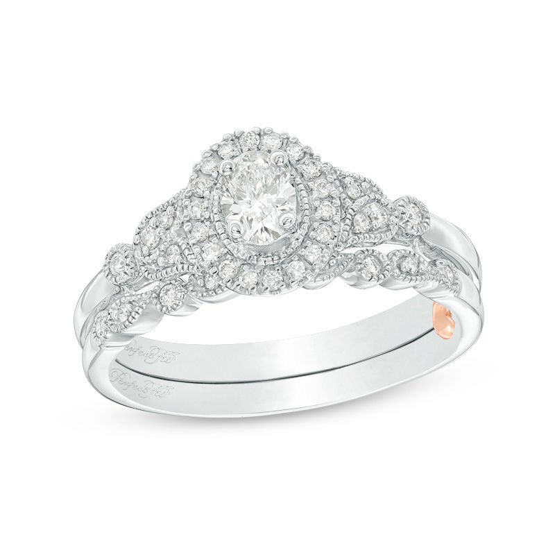 Main Image 1 of Perfect Fit 0.50 CT. T.W. Oval Diamond Frame Vintage-Style Interlocking Bridal Set in 10K White Gold