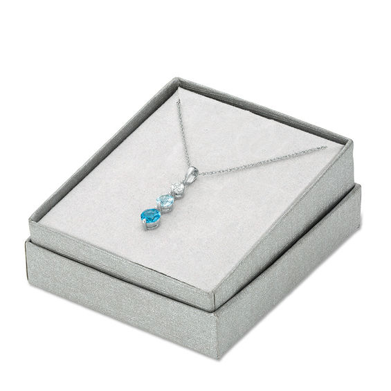 Blue and White Topaz Three Stone Pendant in Sterling Silver Blue and White Topaz Three Stone Pendant in Sterling Silver