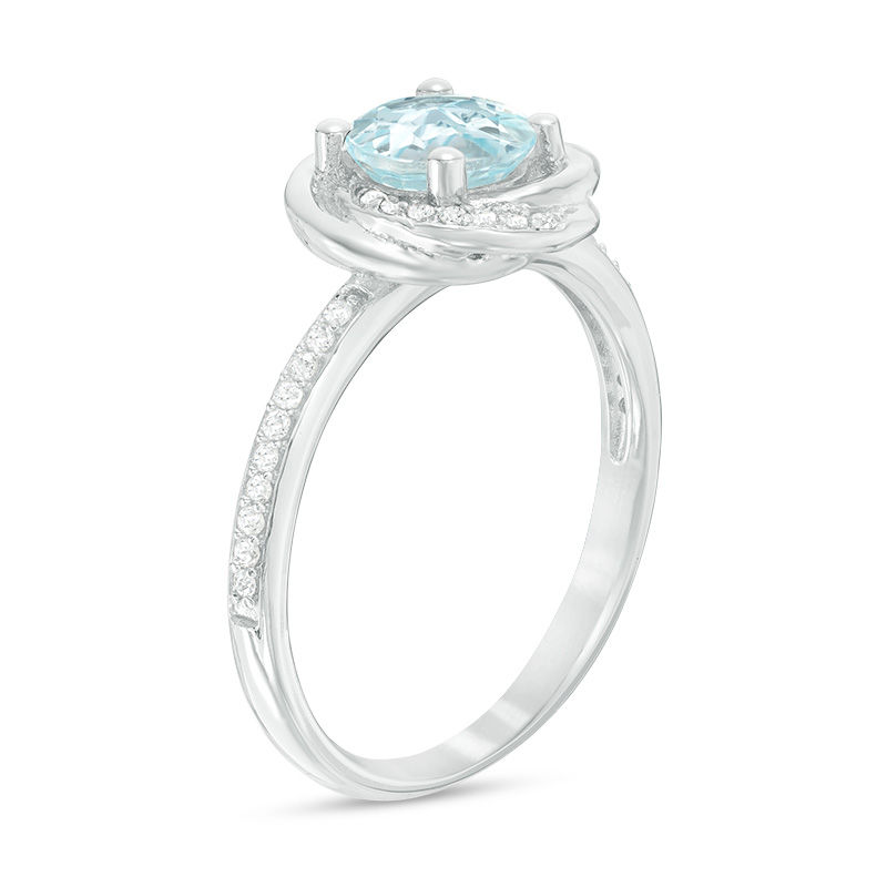 6.0mm Sky Blue Topaz and 0.15 CT. T.W. Diamond Orbit Frame Ring in 10K White Gold