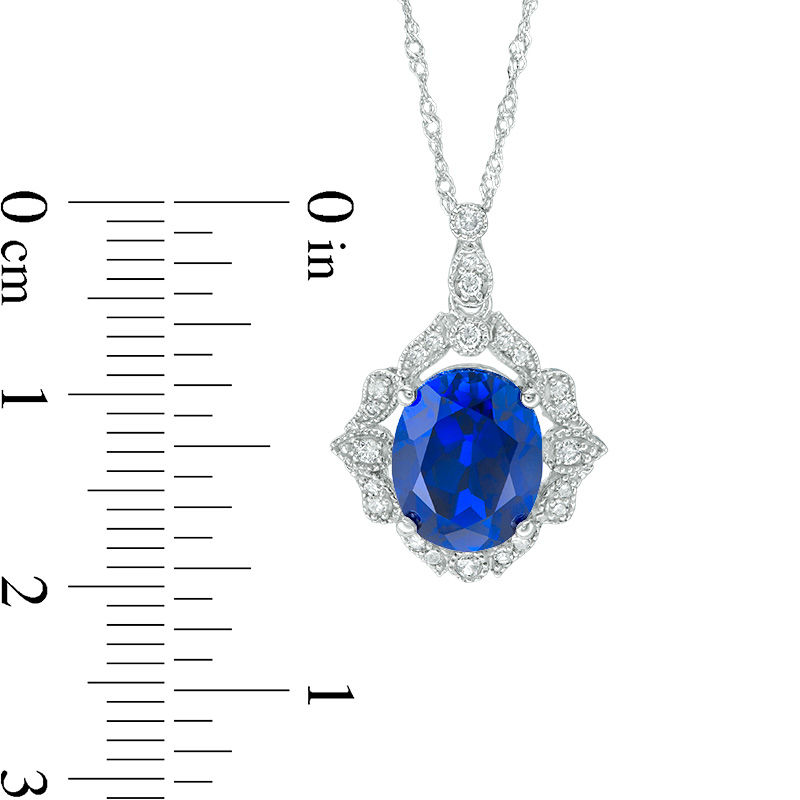 Oval Lab-Created Blue Sapphire and 0.15 CT. T.W. Diamond Vintage-Style Vine Frame Pendant in 10K White Gold
