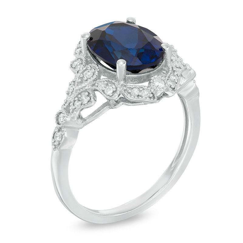 Oval Lab-Created Blue Sapphire and 0.20 CT. T.W. Diamond Vintage-Style Frame Ring in 10K White Gold