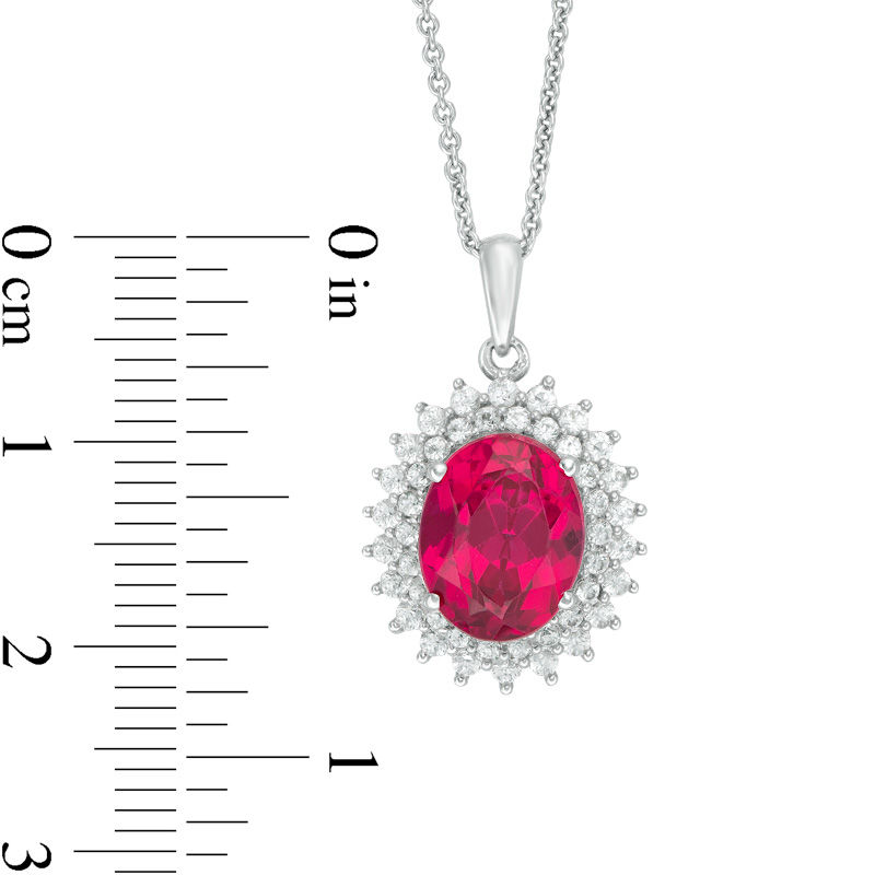 Oval Lab-Created Ruby and White Sapphire Sunburst Frame Pendant in Sterling Silver