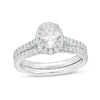 Thumbnail Image 1 of 1.20 CT. T.W. Canadian Certified Oval Centre Diamond Frame Bridal Set in 14K White Gold (I/SI2)