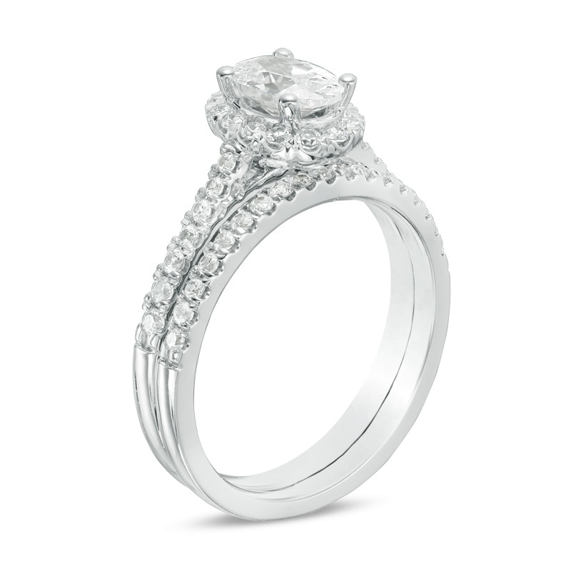 1.20 CT. T.W. Canadian Certified Oval Centre Diamond Frame Bridal Set in 14K White Gold (I/SI2)