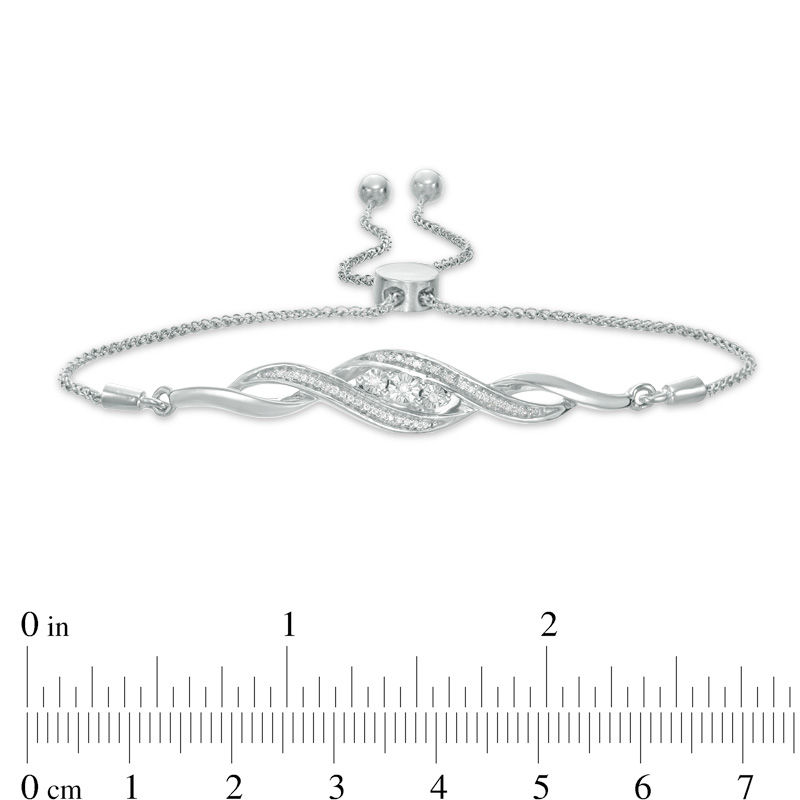 0.066 CT. T.W. Diamond Three Stone Twist Bolo Bracelet in Sterling Silver - 9.5"