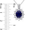 Oval Lab-Created Blue and White Sapphire Sunburst Frame Pendant in Sterling Silver with Diamond Accents