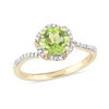 Thumbnail Image 0 of 7.0mm Peridot and 0.10 CT. T.W. Diamond Floral Frame Bypass Ring in 14K Gold