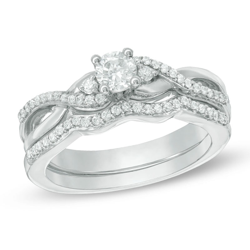 0.29 CT. T.W. Diamond Three Stone Twist Bridal Set in Sterling Silver