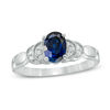 Thumbnail Image 0 of Oval Lab-Created Blue Sapphire and 0.065 CT. T.W. Diamond Layered Shank Promise Ring in 10K White Gold