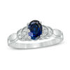 Thumbnail Image 1 of Oval Lab-Created Blue Sapphire and 0.065 CT. T.W. Diamond Layered Shank Promise Ring in 10K White Gold