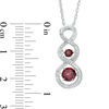 Unstoppable Love™ Garnet and 0.11 CT. T.W. Diamond Cascading Infinity Pendant in Sterling Silver