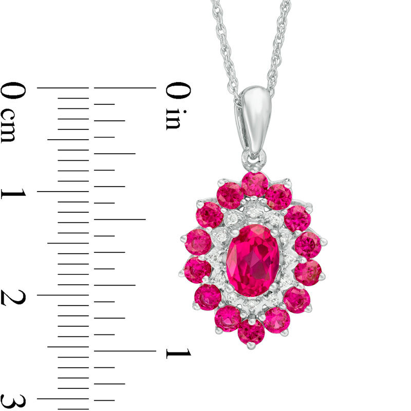 Oval Lab-Created Ruby and 0.04 CT. T.W. Diamond Double Frame Pendant in 10K White Gold|Peoples Jewellers