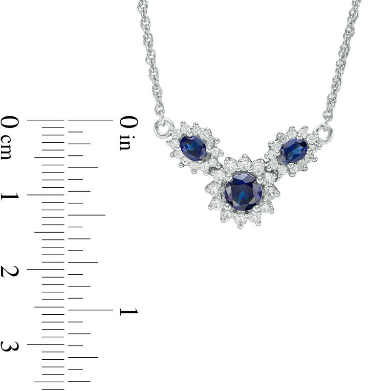 Oval and Round Lab-Created Blue and White Sapphire Sunburst Frame Three Stone Necklace in Sterling Silver