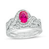 Thumbnail Image 0 of Oval Lab-Created Ruby and 0.45 CT. T.W. Diamond Braided Frame Bridal Set in Sterling Silver