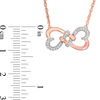 0.086 CT. T.W. Diamond Love Knot Double Heart Necklace in 10K Rose Gold - 17.5"