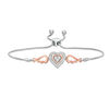 Thumbnail Image 0 of 1/15 CT. T.W. Diamond Double Heart with Wings Bolo Bracelet in Sterling Silver and 10K Rose Gold (1 Line) - 9.5"