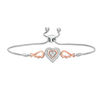 Thumbnail Image 1 of 1/15 CT. T.W. Diamond Double Heart with Wings Bolo Bracelet in Sterling Silver and 10K Rose Gold (1 Line) - 9.5"
