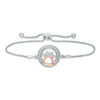 Thumbnail Image 1 of 1/15 CT. T.W. Diamond Open Circle with Paw Print Bolo Bracelet in Sterling Silver and 10K Rose Gold (1 Line) - 9.5"