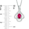 Oval Lab-Created Ruby and 0.148 CT. T.W. Diamond Teardrop Frame Leaf Pendant in 10K White Gold