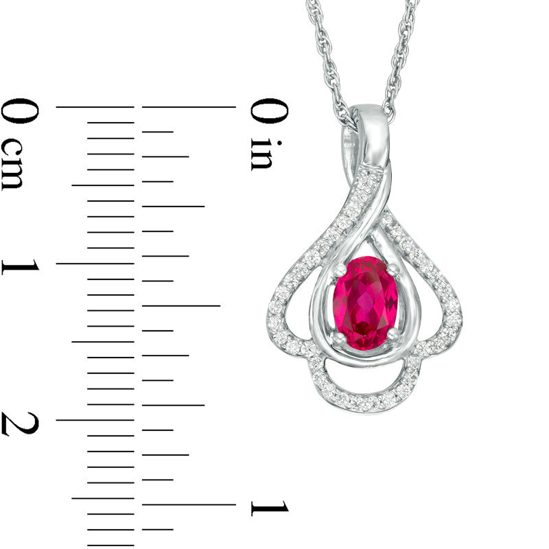 Oval Lab-Created Ruby and 0.148 CT. T.W. Diamond Teardrop Frame Leaf Pendant in 10K White Gold