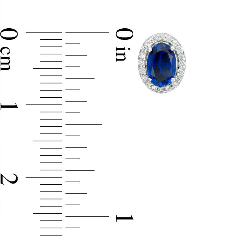 Main Image 2 of Oval Lab-Created Blue Sapphire and 0.14 CT. T.W. Diamond Frame Stud Earrings in 10K White, Yellow or Rose Gold
