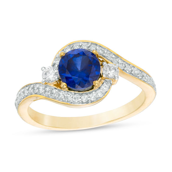 6.0mm Lab-Created Blue Sapphire and 0.23 CT. T.W. Diamond Three Stone Bypass Ring in 10K Gold